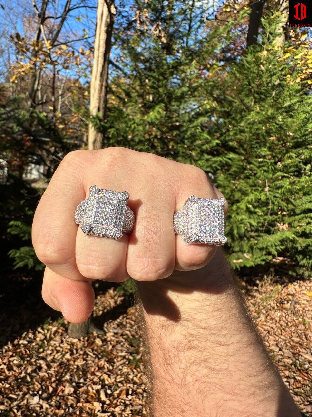 A Person Showing two Sizes of 14k White Gold Iced out Moissanite  Ring