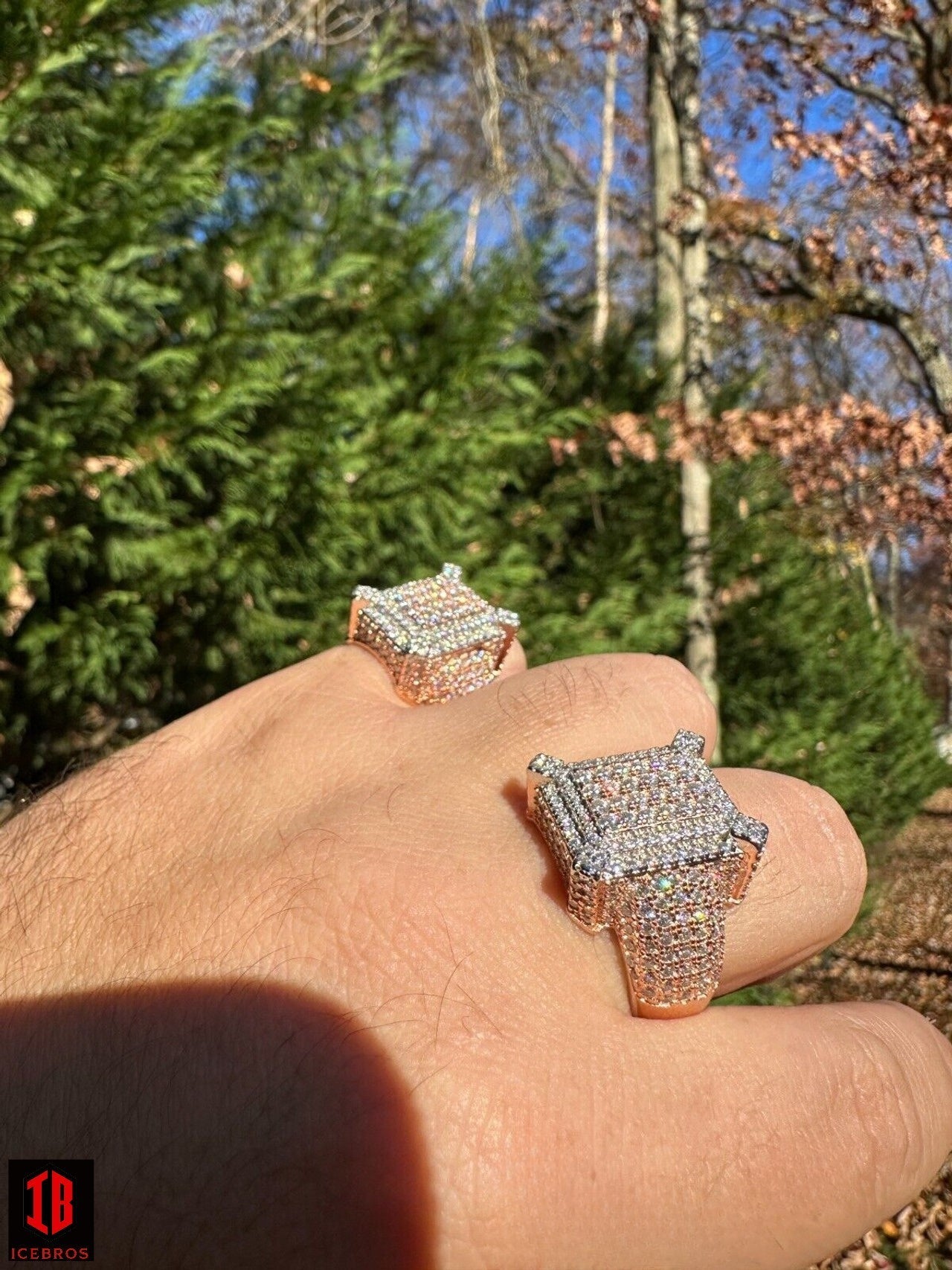 A Person Wearing 2 Different Sizes of Fully Iced Moissanite Ring in 14k Rose Gold