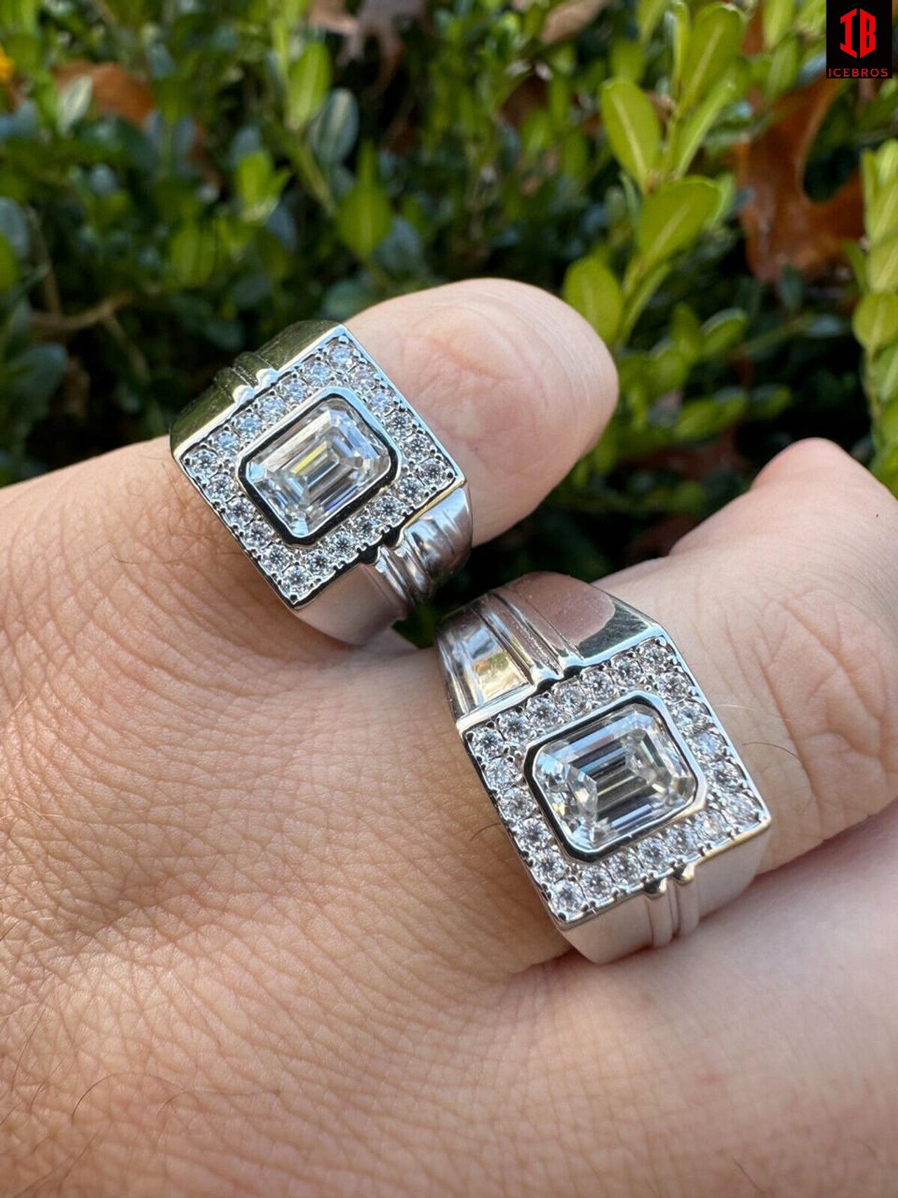 A Zoomed In View of 14k White Gold Emerald Cut Moissanie Pinky Rings On Men's Hand