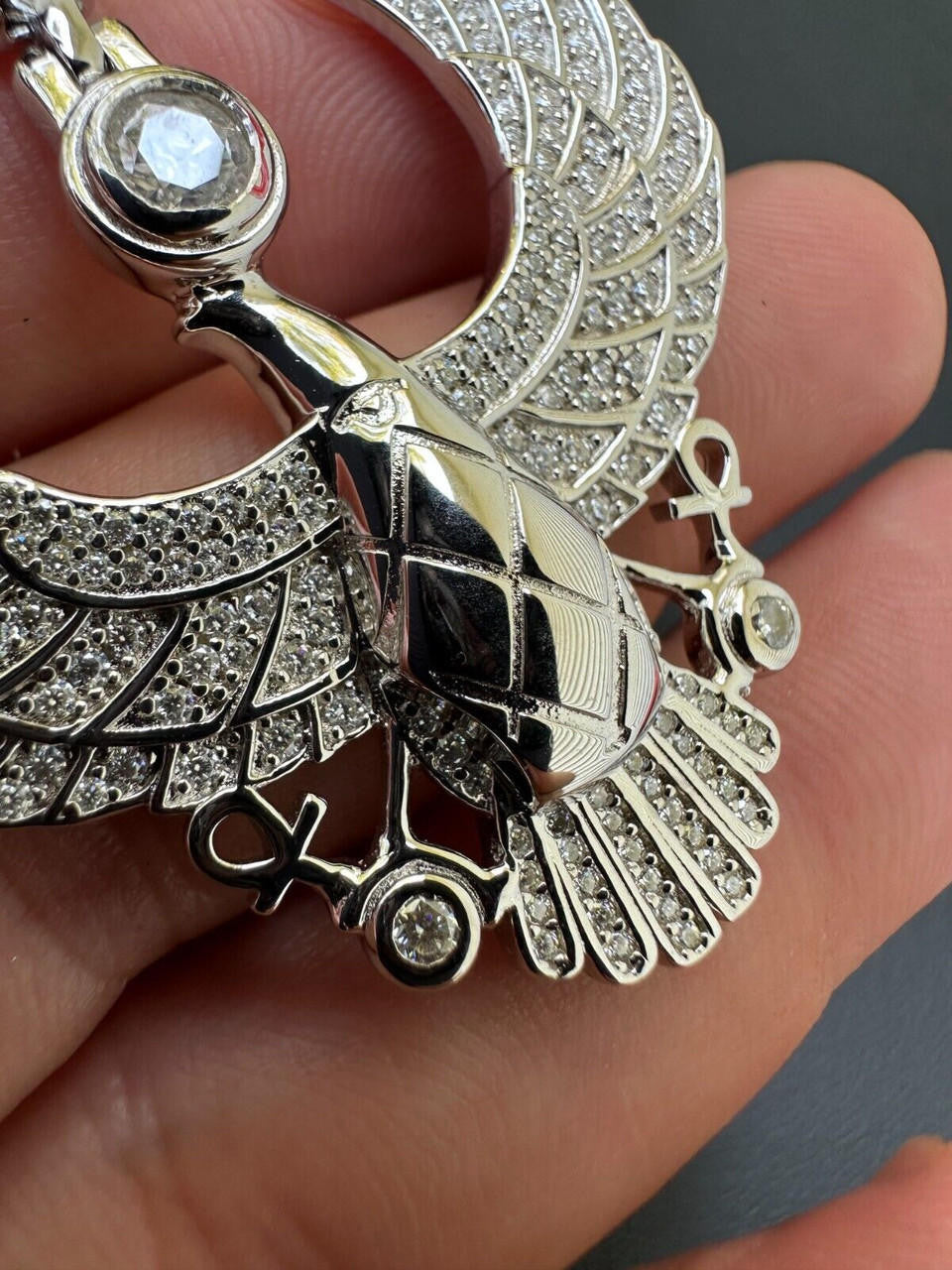 A Detailed View of 14k White Gold Moissanite Horus Falcon Wing Pendant Necklace