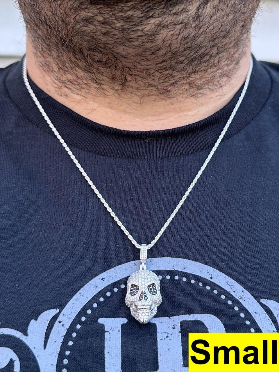 A Men Wearing 14k White Gold Skull Pendant Necklace with White & Black Moissanite Stones with 14k White Gold Twisted Rope Chain