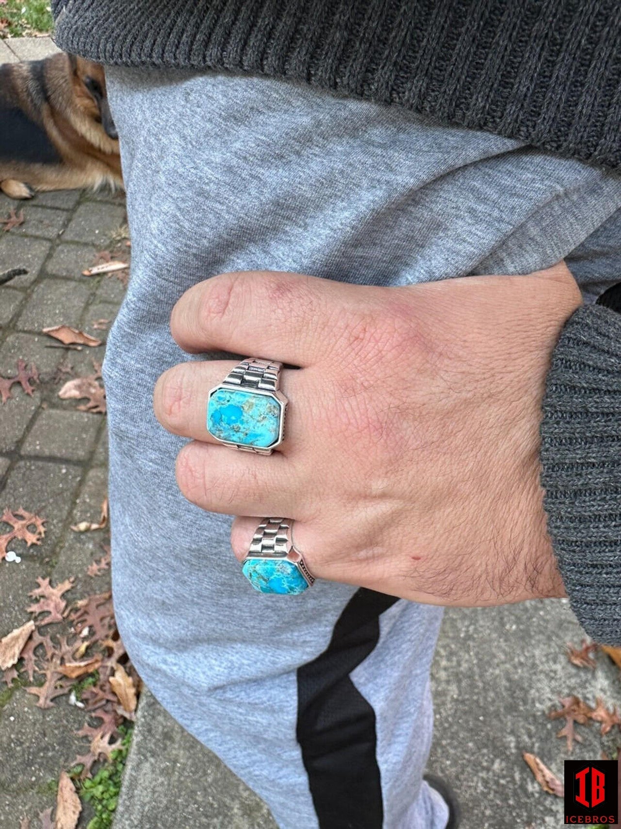 a man Wearing two sizes of  Blue Turquoise Square Cut Ring in hand Showing its Beautiful design and color